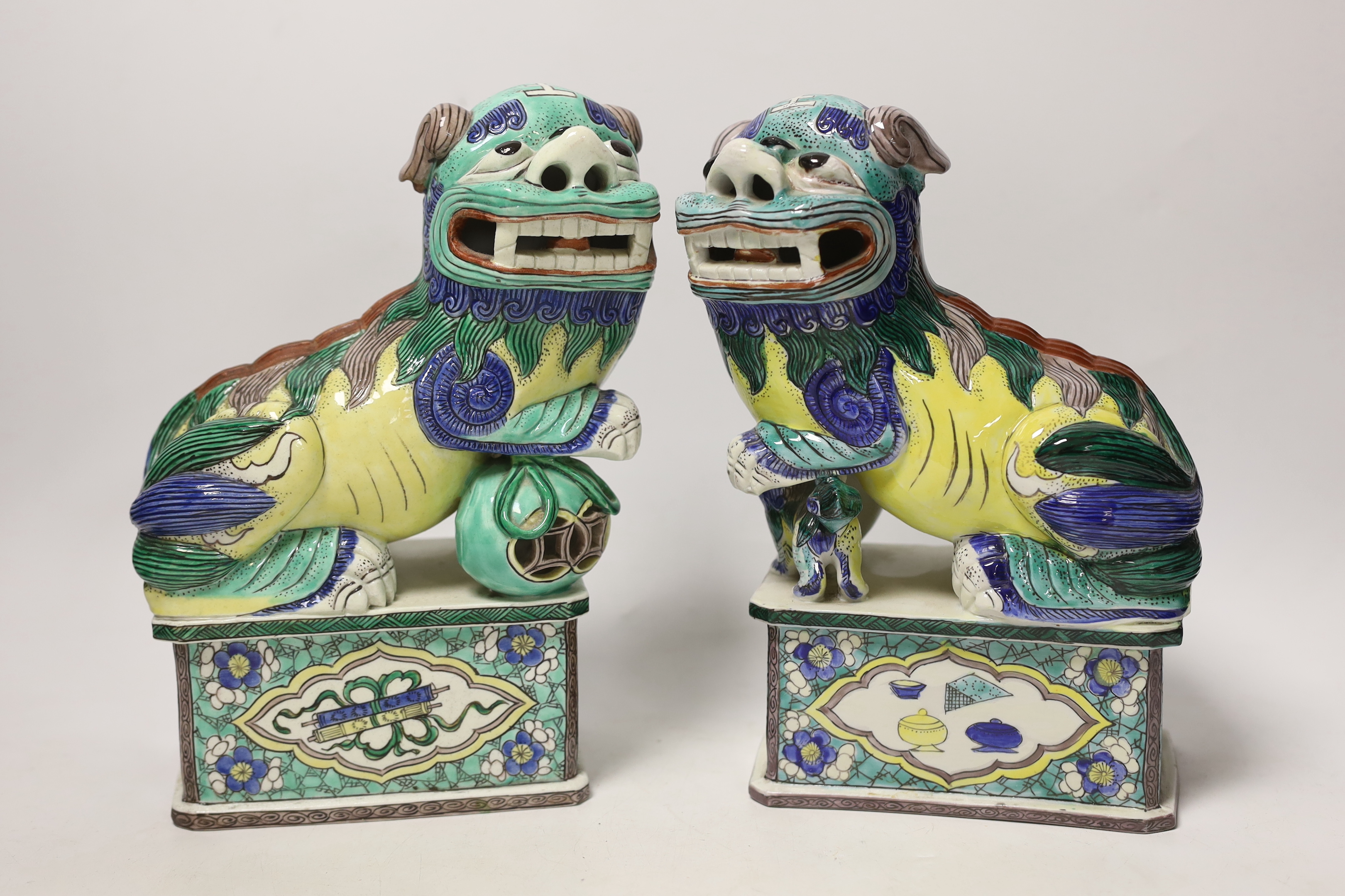 A pair of large 20th century Chinese or Samson enamelled porcelain figures of Buddhist Lions, 24cm